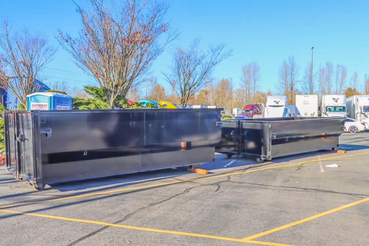 Professional dumpster rental service with roll-off container on residential driveway in Cromwell